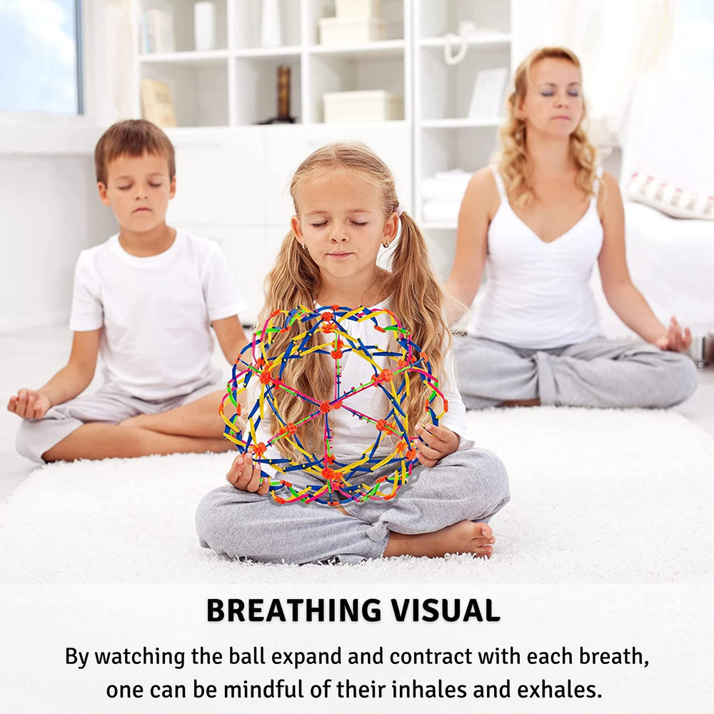 4E's Novelty breathing ball in hand used for focus and tactile relief