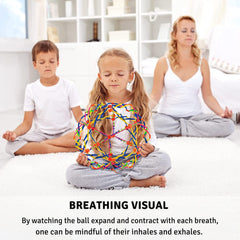 4E's Novelty breathing ball in hand used for focus and tactile relief