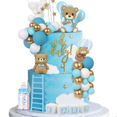 Acmee blue bear cake toppers decorate a celebration scene.