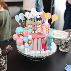 Acmee white ladder cake topper creates a whimsical focal point.