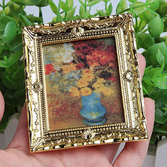 Acxico miniature gold frame art pieces serve as photography props for tiny scenes.