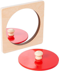 Adena Montessori mirror-reflection play encourages self-awareness during activity.