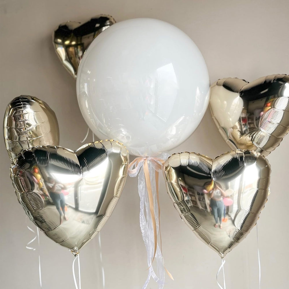 Adorely champagne-gold hearts decorate gender reveals with a subtle shine.