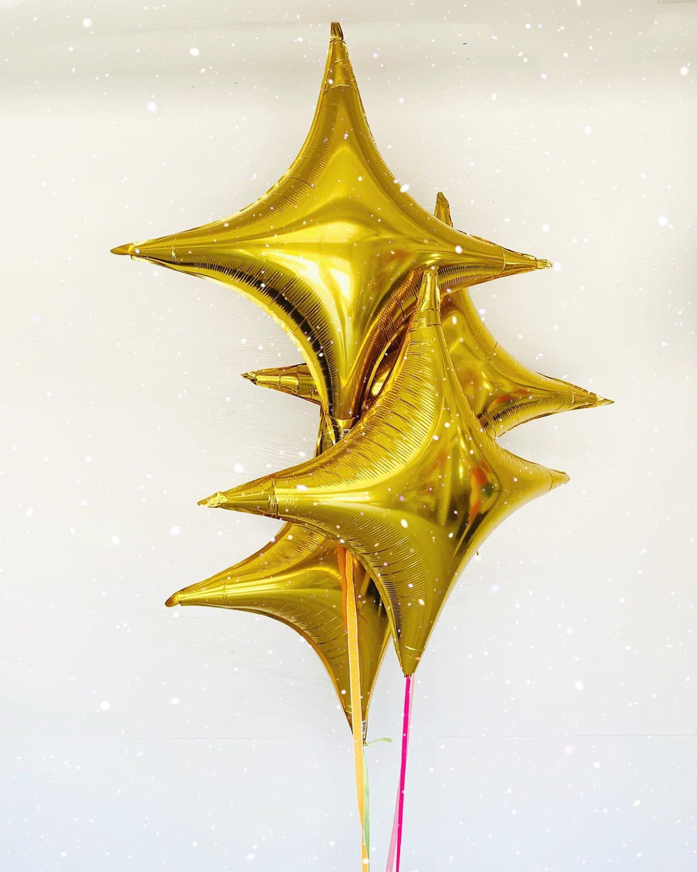 Adorely Gold Star Balloons arranged in a party bouquet for festive ambience.