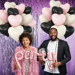 Adorely heart foil balloons used as a backdrop for memorable party photos