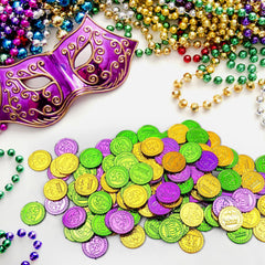 ADXCO Mardi Gras coins being tossed by hand for float parades and games.