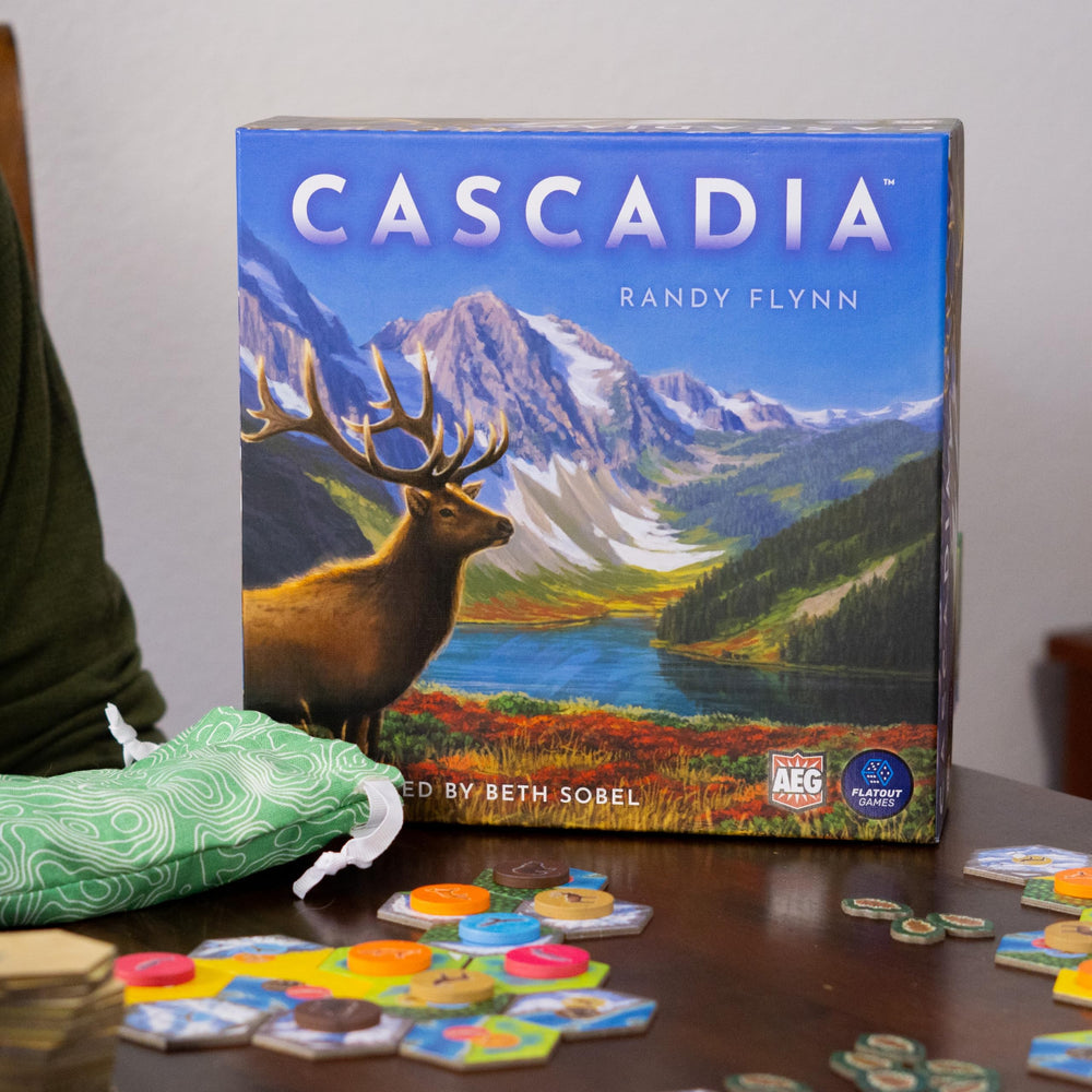 AEG Cascadia box art invites curiosity with Pacific Northwest imagery.