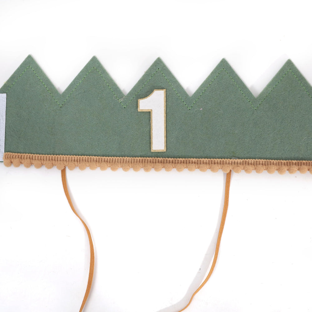 Number 1 accent on the crown emphasizes the milestone.