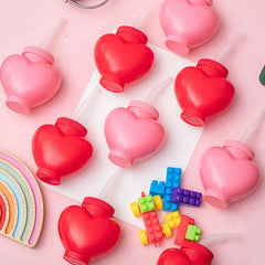 Children using Amyhill heart cups as party favors or gifts