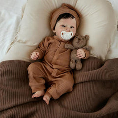 Anano Realistic Reborn Baby Doll with bottle and pacifier for nurturing play.