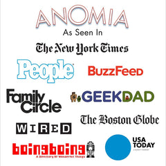 A diverse group enjoys Anomia during a family game night.