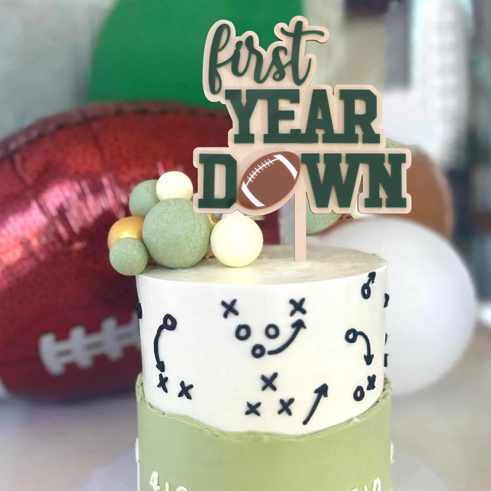 AOQURE wooden topper adds sporty charm to birthday celebrations.