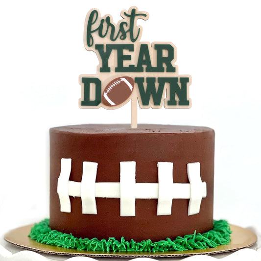 AOQURE wooden football 1st birthday cake topper showcases natural wood grain.