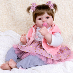 Aori 22-inch realistic reborn baby doll posing in pink outfit for imaginative play and display
