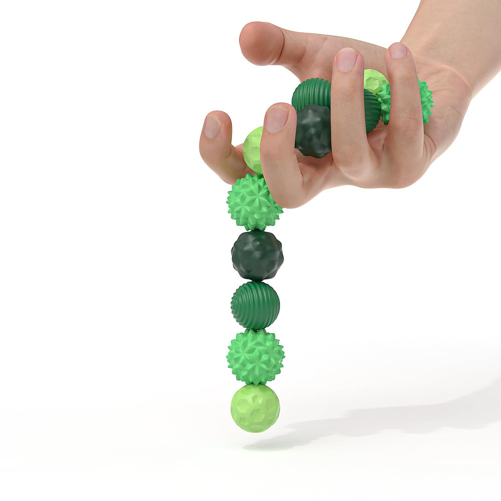 Hands manipulating AotBlcer magnetic balls demonstrate spinning and bouncing modes.