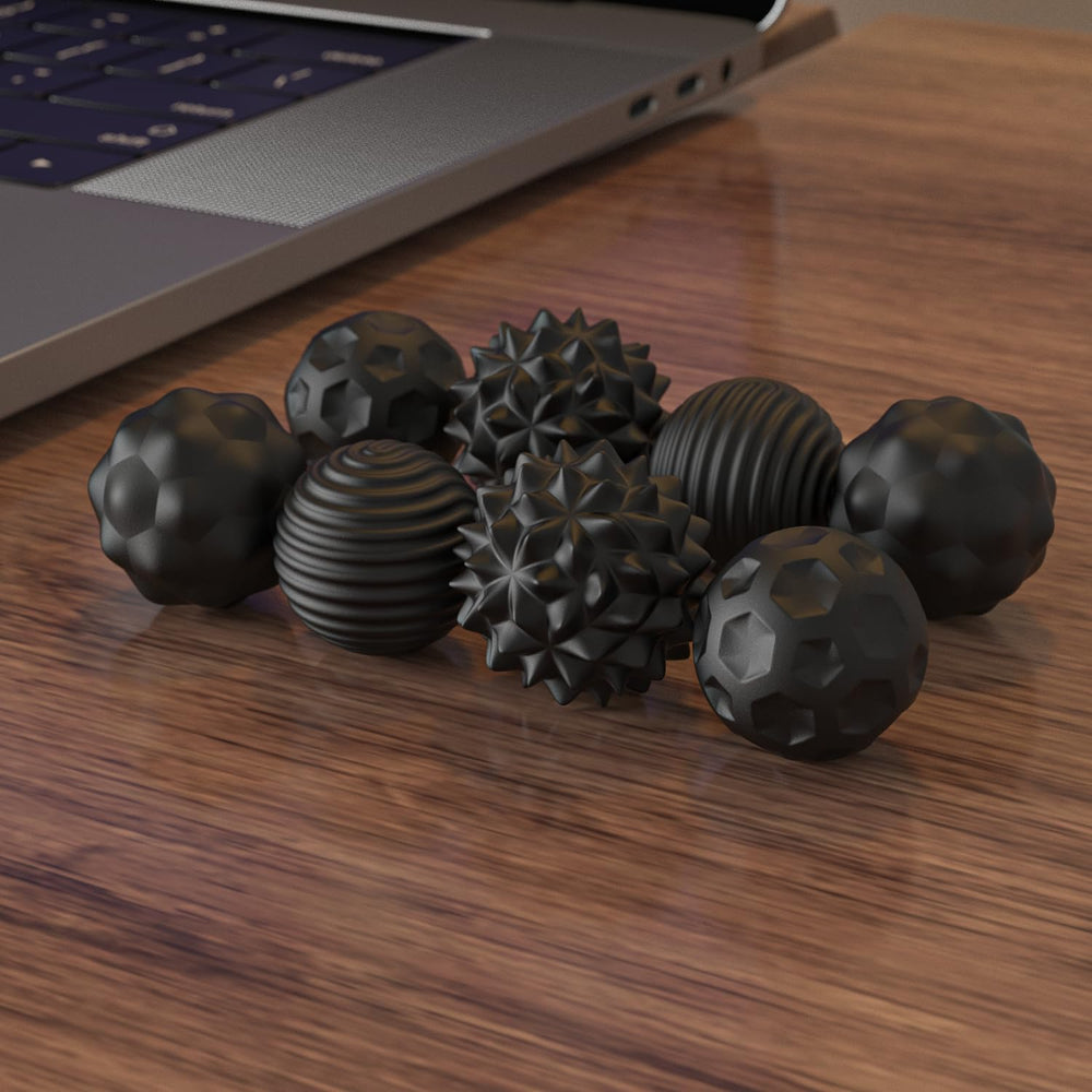 AotBlcer Magnetic Balls on office desk promoting focus during tasks.