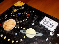 Apostrophe Games quad-fold board demonstrates compact storage and transport