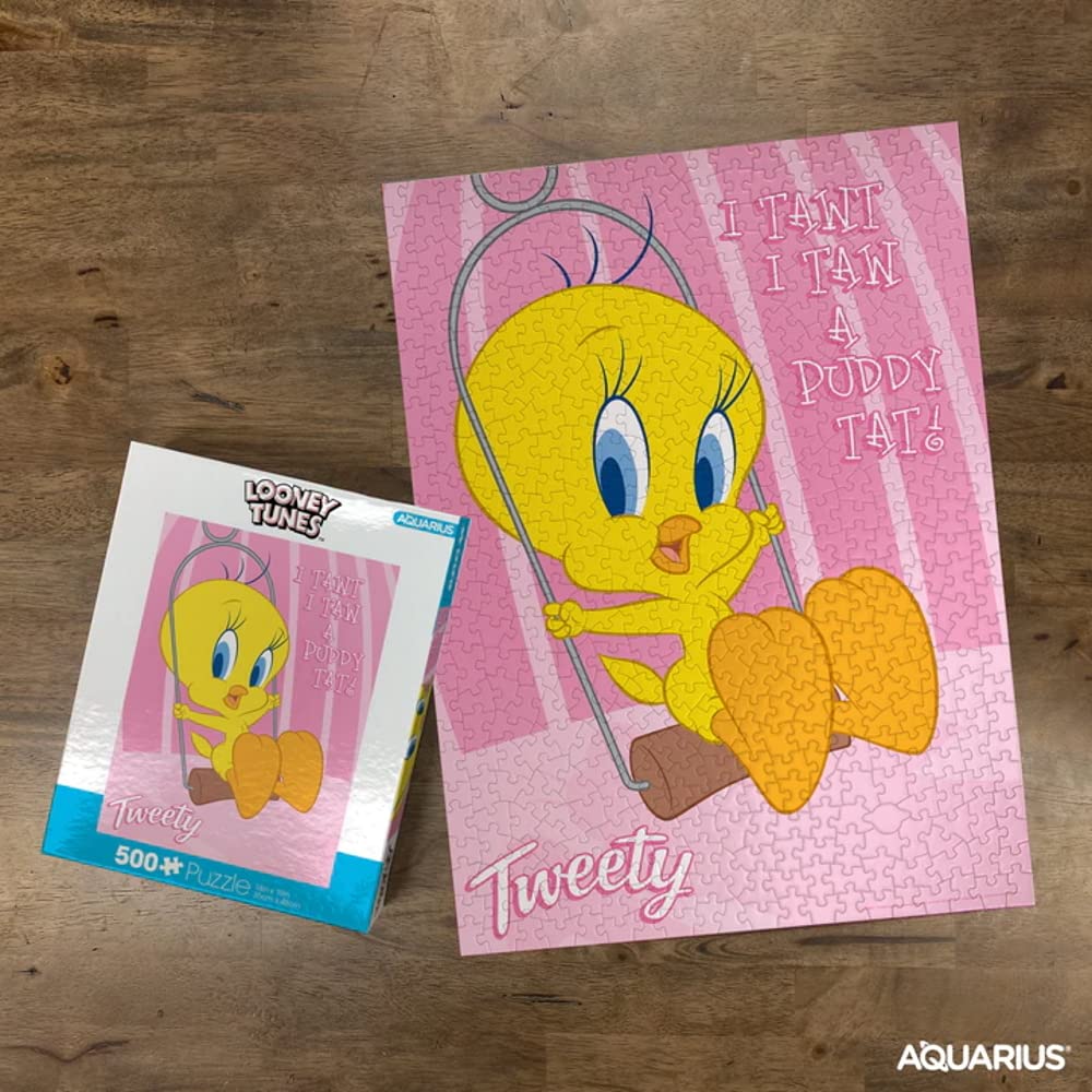 Hands assembling Aquarius Tweety puzzle, highlighting shared activity and fun.
