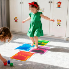 Art3d colourful liquid tiles arranged as a dance floor in a kids' room.