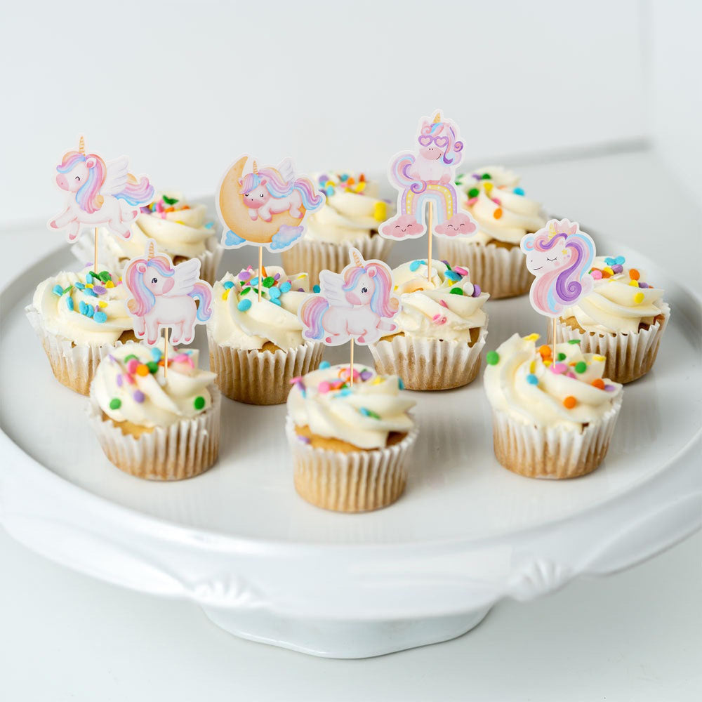 Arthsdite unicorn toppers on a birthday cake create a festive focal point