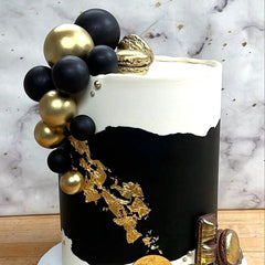 ASTARON ball cake topper 4cm black creates a noticeable accent.