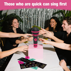 ATG Mic Karaoke players laughing during a lively game night.