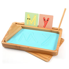 AtMini Montessori sand tray with blue lid for organized sensory play and handwriting practice.