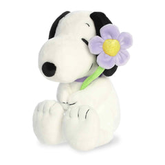 Aurora Adorable Peanuts Snoopy plush with purple flower offers soft cuddling.