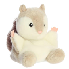 Cream fur and russet tail close-up highlights soft texture for cuddles.