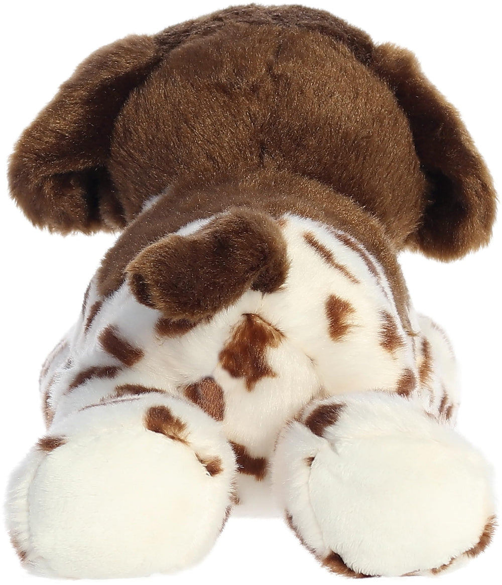 Aurora Gio Flopsie plush resting on its belly for easy playtime and display