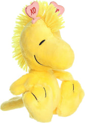 Aurora Woodstock plush with XO hearts headband, ideal for cheerful gifting.