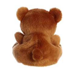 Aurora Artie Bear in hand, compact cuddly buddy for on-the-go