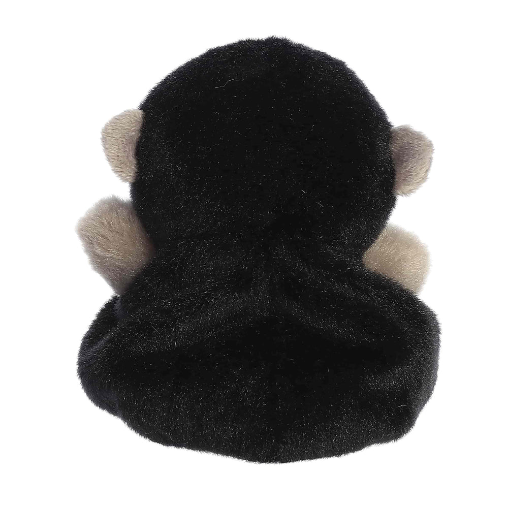 Aurora Palm Pals Gunga Gorilla plush in hand, perfect travel companion.