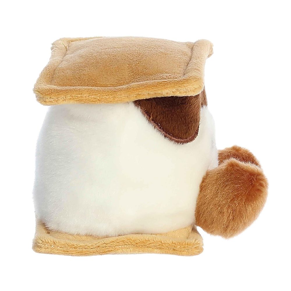 Aurora Palm Pals Toastee S'More plush in hand, portable happiness for travel.
