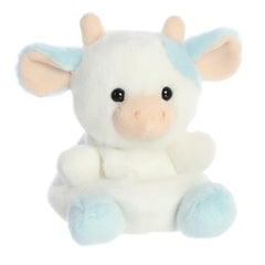 Aurora Skyla Blueberry Cow plush held in hand to emphasize palm sized design