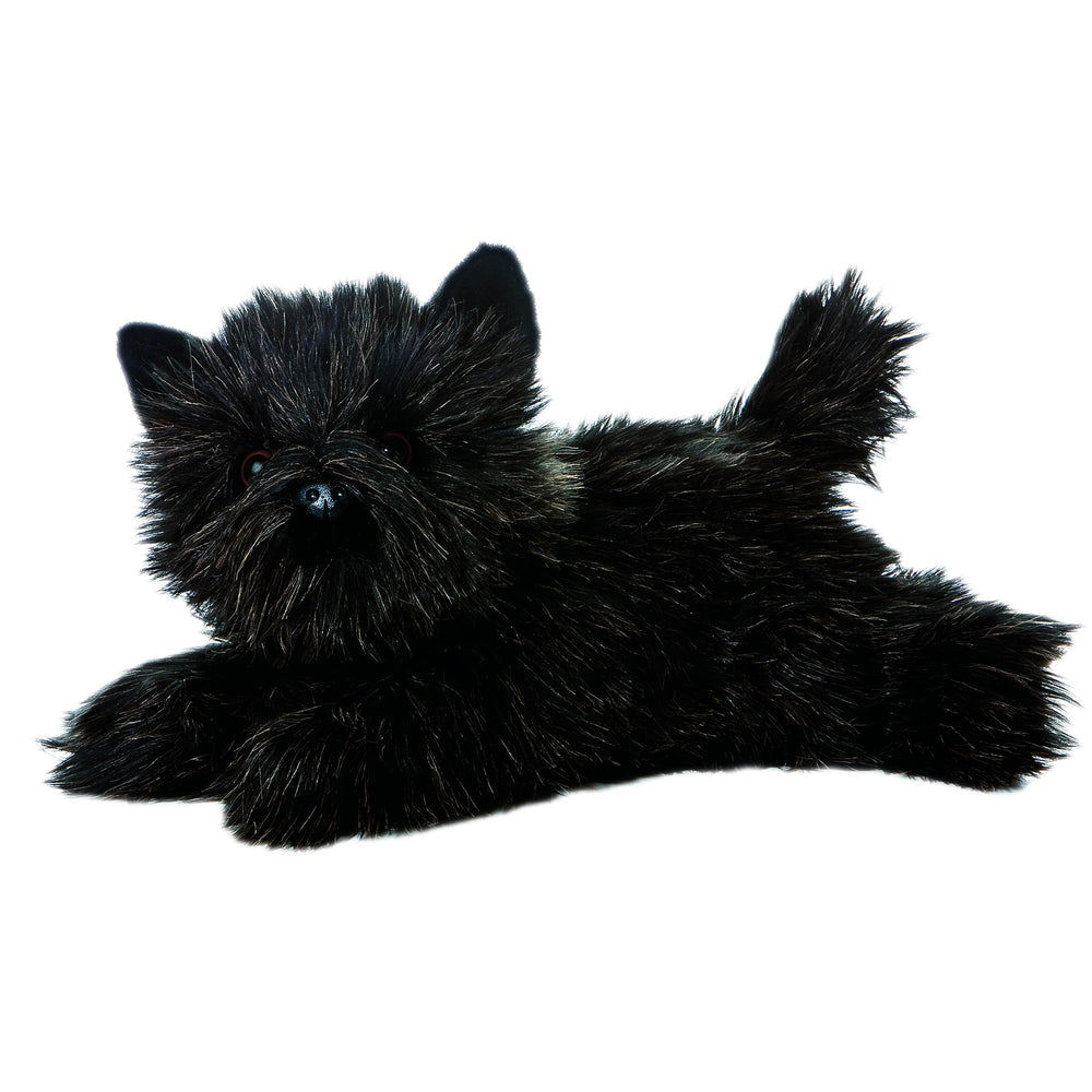 Aurora Toto Flopsie 12-inch plush resting on belly, perfect cuddle buddy for kids.
