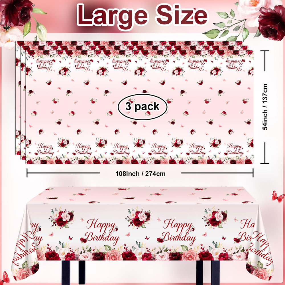 Elegant burgundy and pink floral print enhances birthday table settings.