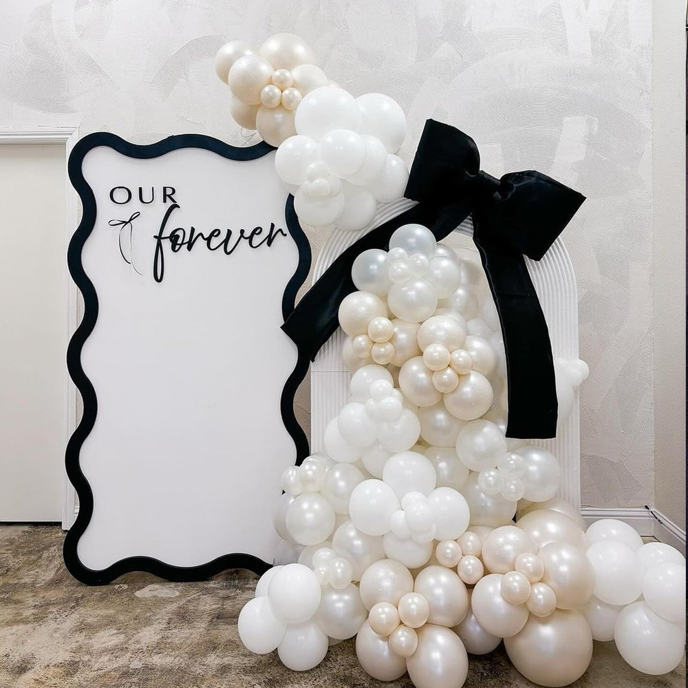 awenztech Baby shower setup with pearl balloons adds soft festive touches.