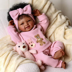 BABESIDE poseable doll with pacifier for interactive dress-up and cuddles.