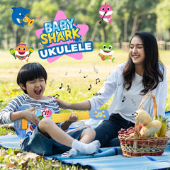 Kid plays during playtime, creating simple melodies with the ukulele.