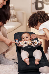 The BabyBjörn Googly Eyes Toy is easy to attach or remove.