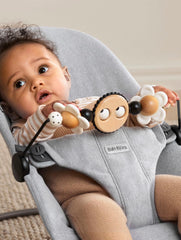 BabyBjörn Googly Eyes Toy's spinning bar for tracking and smiles.
