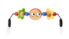BabyBjörn Googly Eyes wooden toy on a bouncer for colorful stimulation