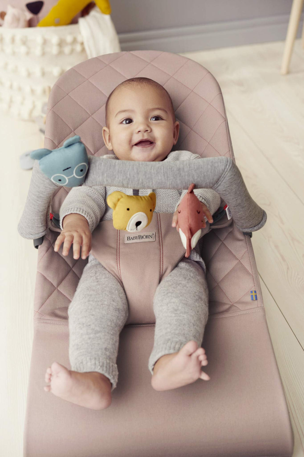 BabyBjörn Soft Friends bell provides gentle auditory cues during bouncer movement