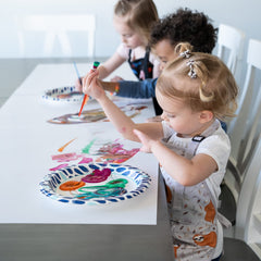 BABYBOET kids apron in use during painting to manage spills