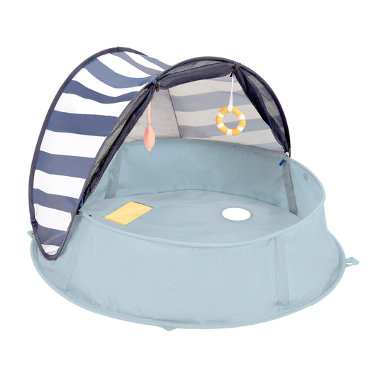 Babymoov Aquani pop-up tent assembly for quick shade and sun protection.