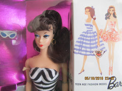 Barbie 1959 reproduction doll in box with sunglasses and high heel shoes.