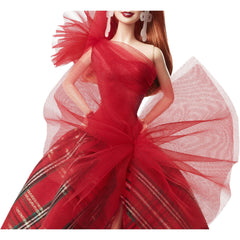 Barbie 2024 Holiday doll in display packaging, premium collectible presentation.