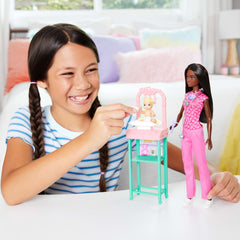 Barbie in pink scrubs with stethoscope ready for nurturing checkups and care.