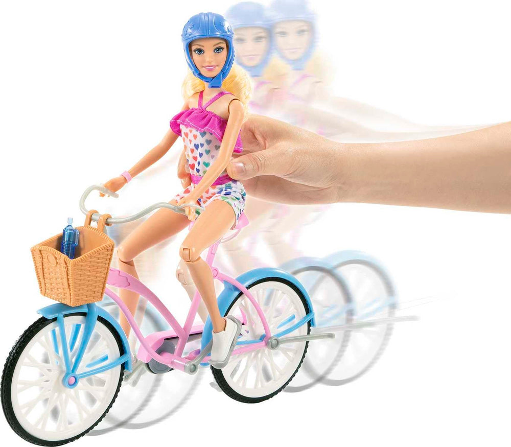Barbie bike with rolling wheels and pedals for easy pretend rides.